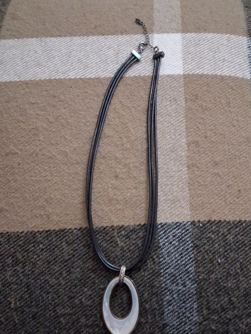 Monet Black Multi-Cord Necklace with Silver Oval Pendant